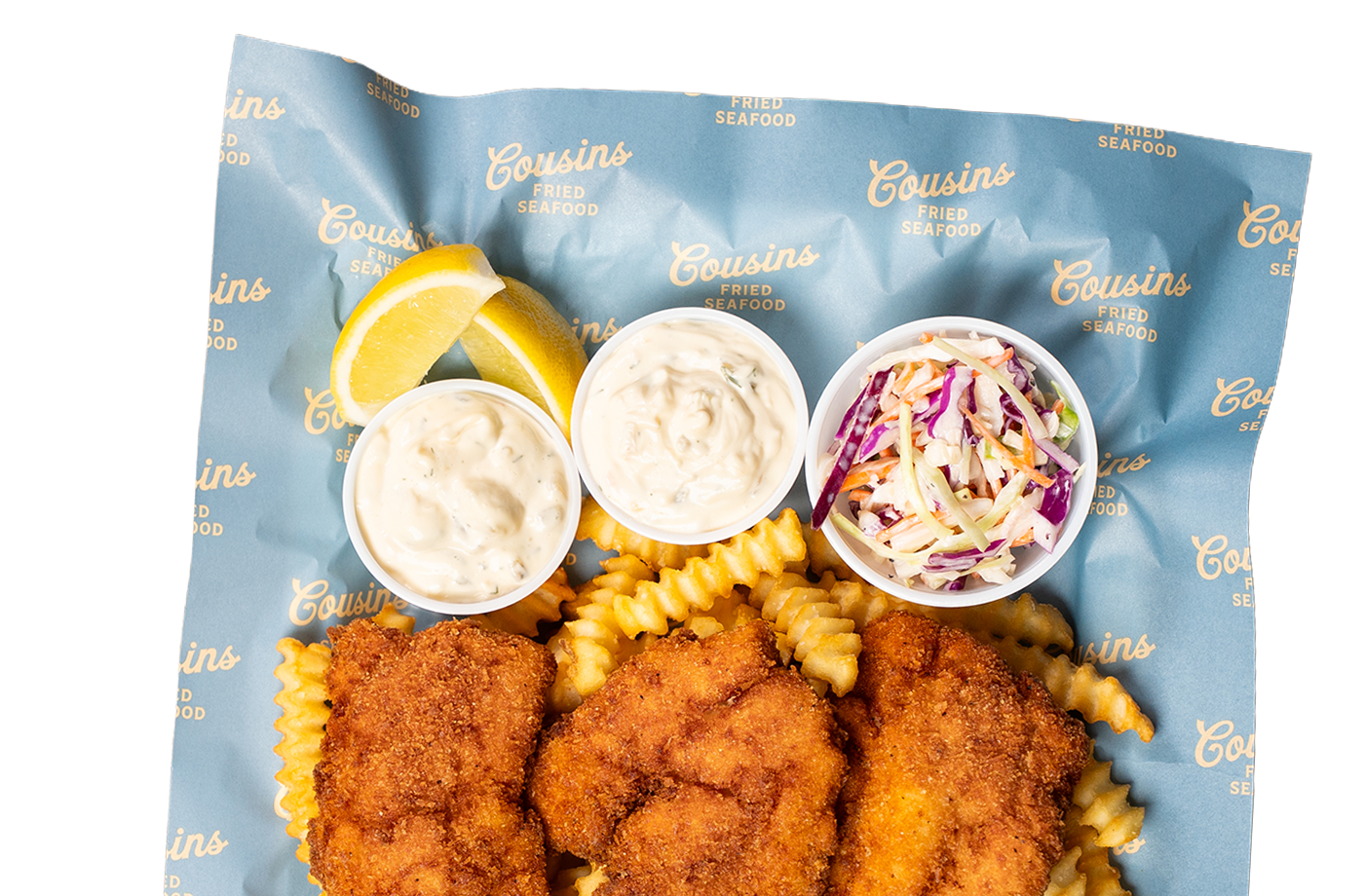 Cousins Fried Seafood haddock platter with fries, coleslaw, lemon, and sauces